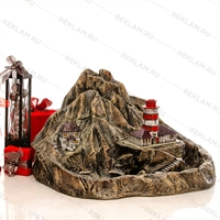 каменный фонтан маяк на скале